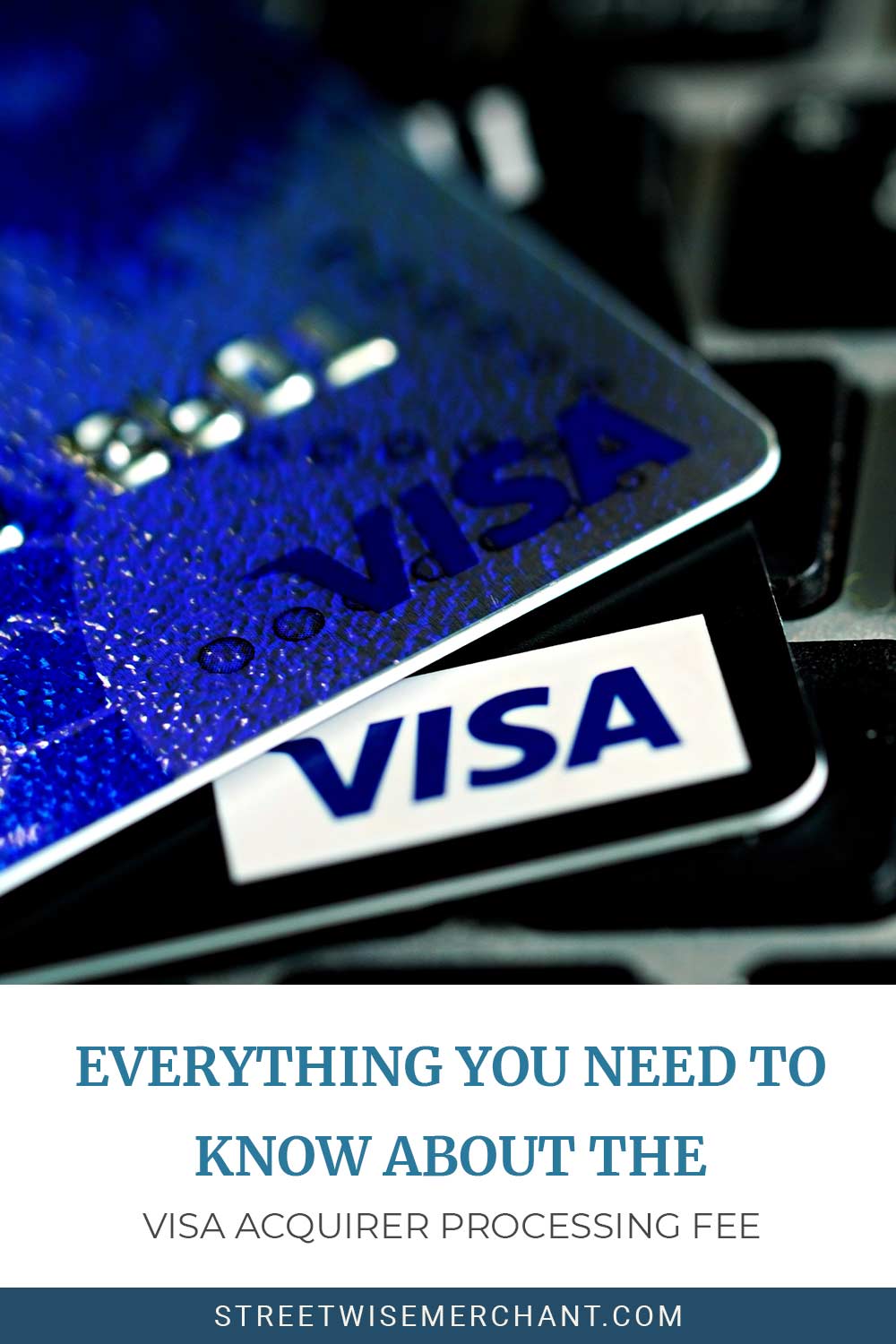 Visa cards on a laptop keyboard - Everything You Need to Know About the Visa Acquirer Processing Fee.