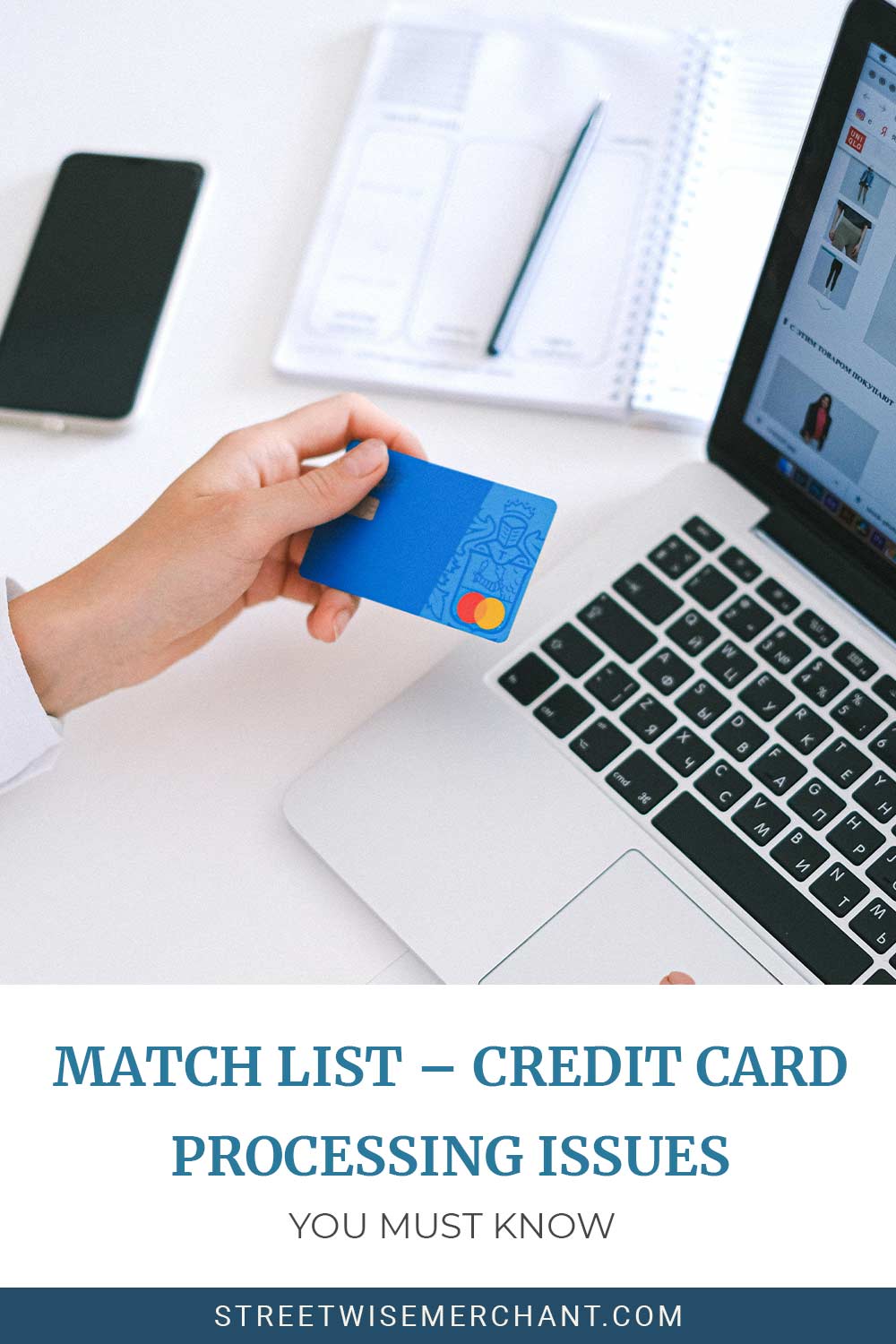 Person holding a blue colour payment card and a laptop on a desk in front of him and exercise book,pen,mobile phone beside it - MATCH List - Credit Card Processing Issues You Must Know.