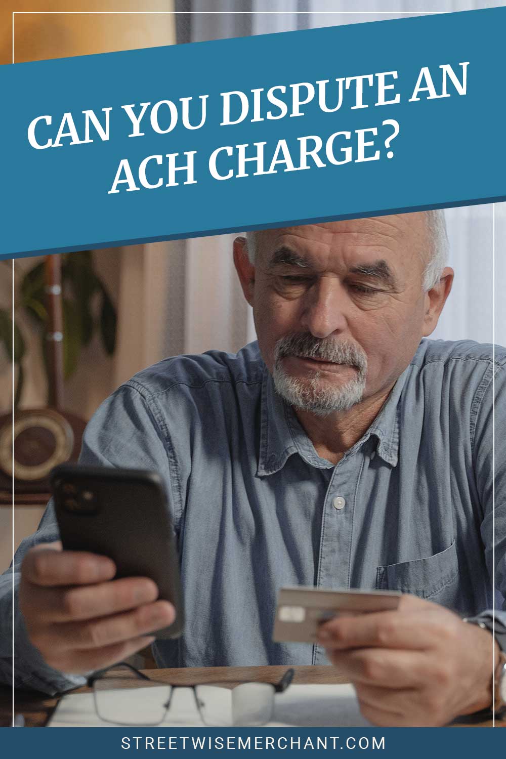 Old man looking at his phone with a debit card in hand - Can You Dispute an ACH Charge?