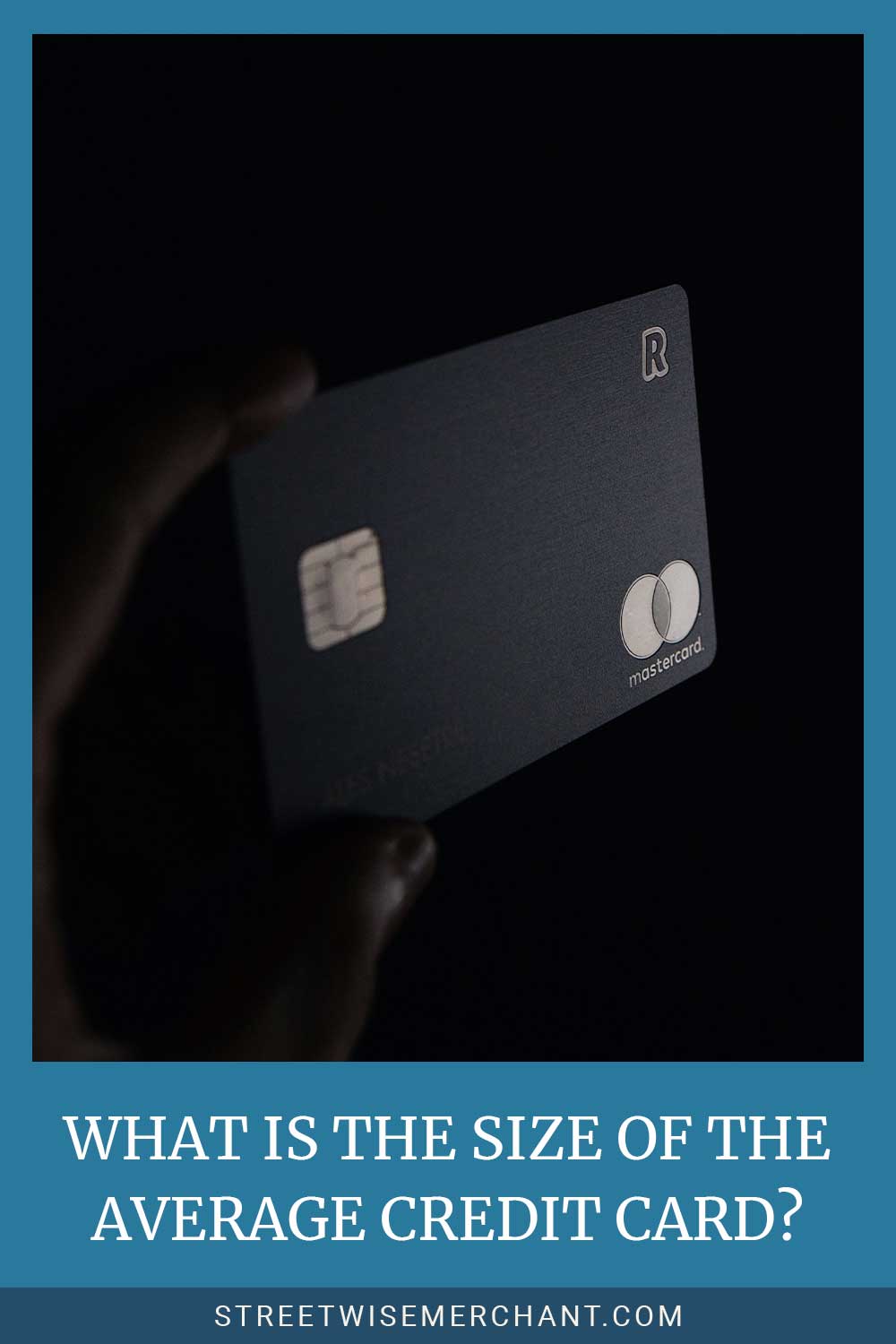A Mastercard held by a hand - What is the Size of the Average Credit Card?